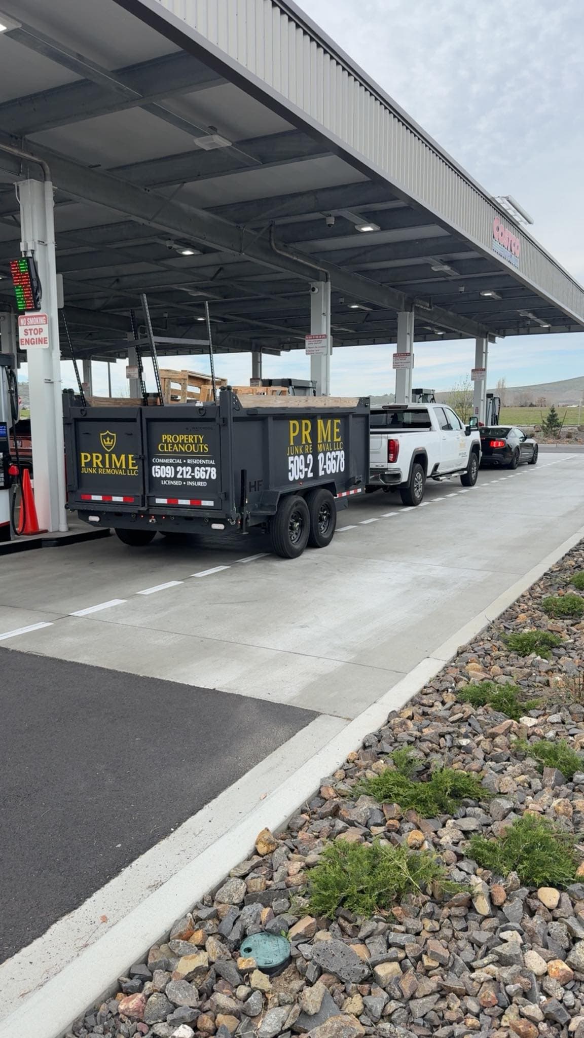 Prime Junk Removal branded truck and trailer